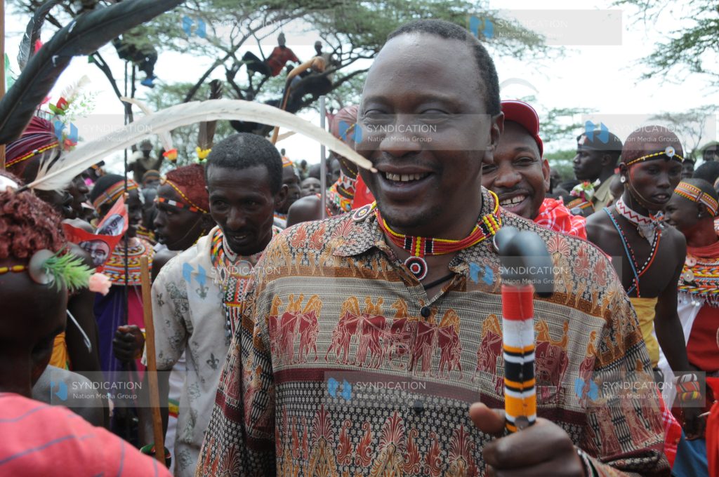 Deputy Prime Minister Uhuru Kenyatta is entertained by traditional dancers and TNA supporters