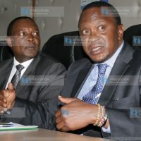 The deputy Prime minister and the minister for finance Uhuru Kenyatta flanked by the CBK governor Prof Njuguna Ndungu