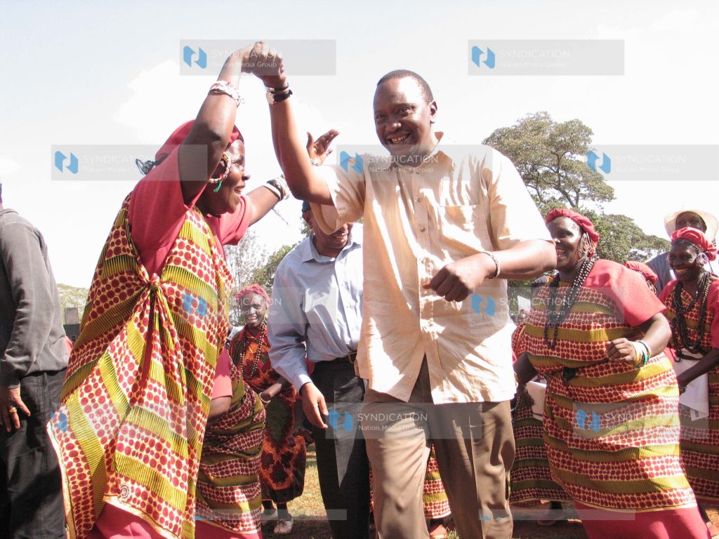 Deputy prime minister Uhuru Kenyatta joins in a traditional dance