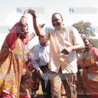 Deputy prime minister Uhuru Kenyatta joins in a traditional dance