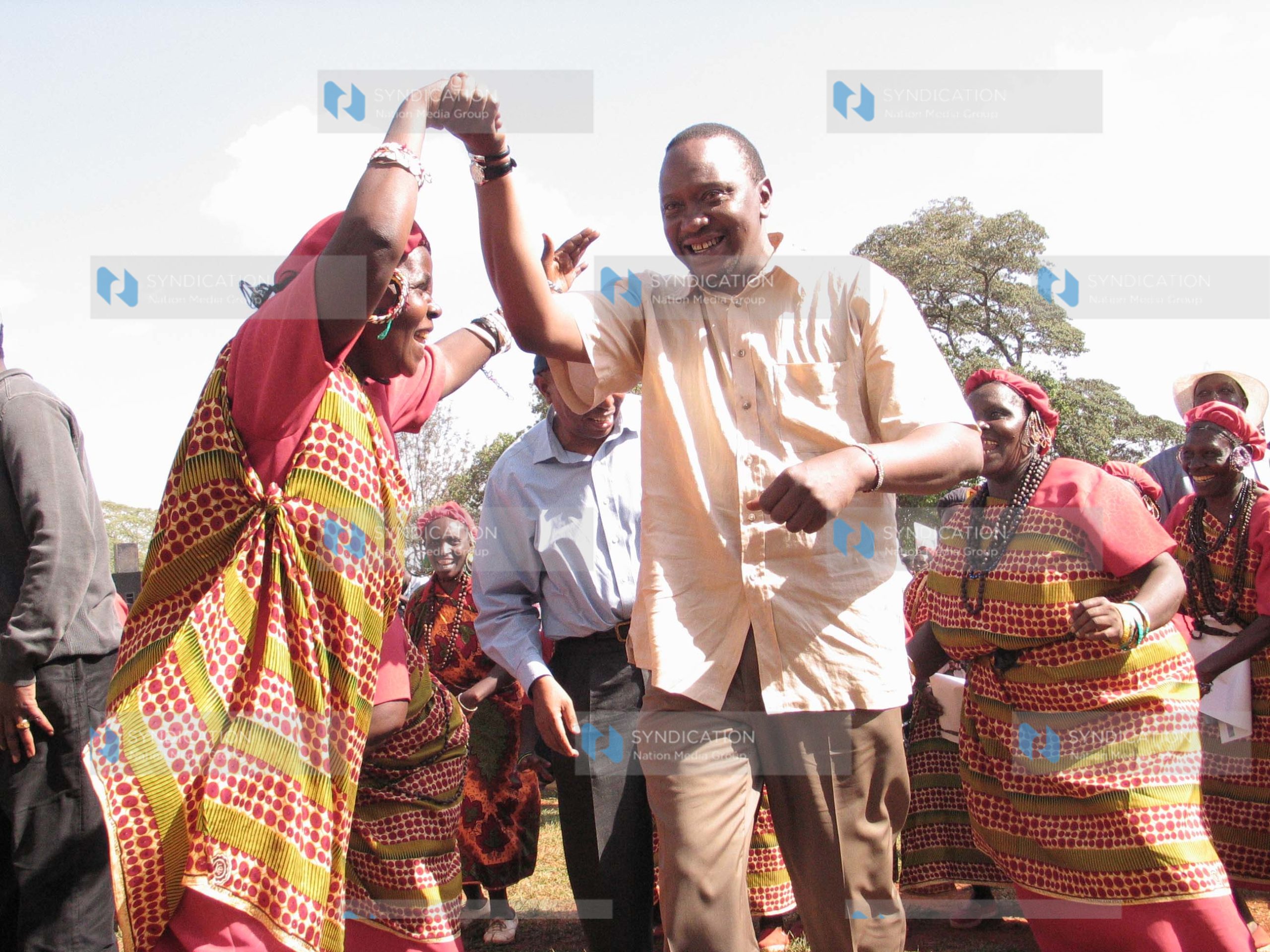 Deputy prime minister Uhuru Kenyatta joins in a traditional dance