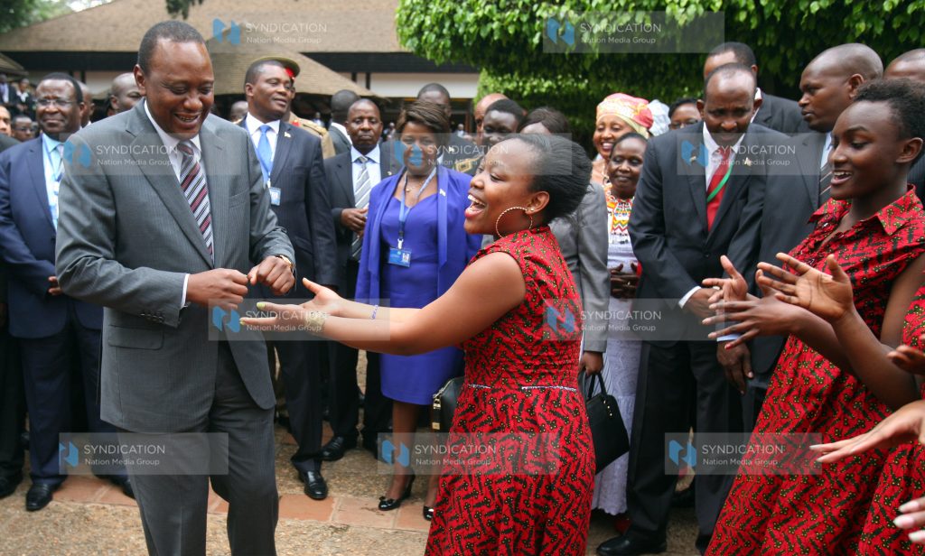 President Uhuru Kenyatta dancing with members of Kenyan Girls Choir