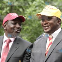 TNA presidential aspirant Uhuru Kenyatta chats with his running mate William Ruto