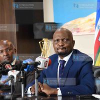 Trade Cabinet Secretary Moses Kuria flanked by advisor Dr Peter Mbae