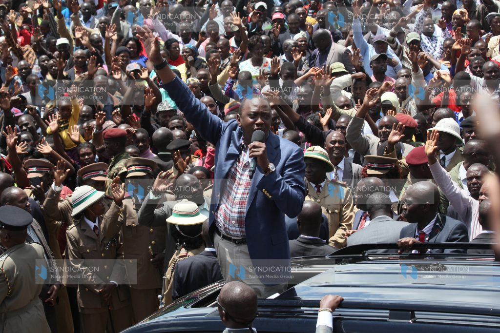 President Uhuru Kenyatta speaks to members of the public in Kebirigo