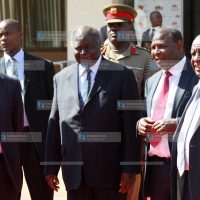 President Mwai Kibaki (second left) chats with Equity Bank Chief Executive Officer James Mwangi