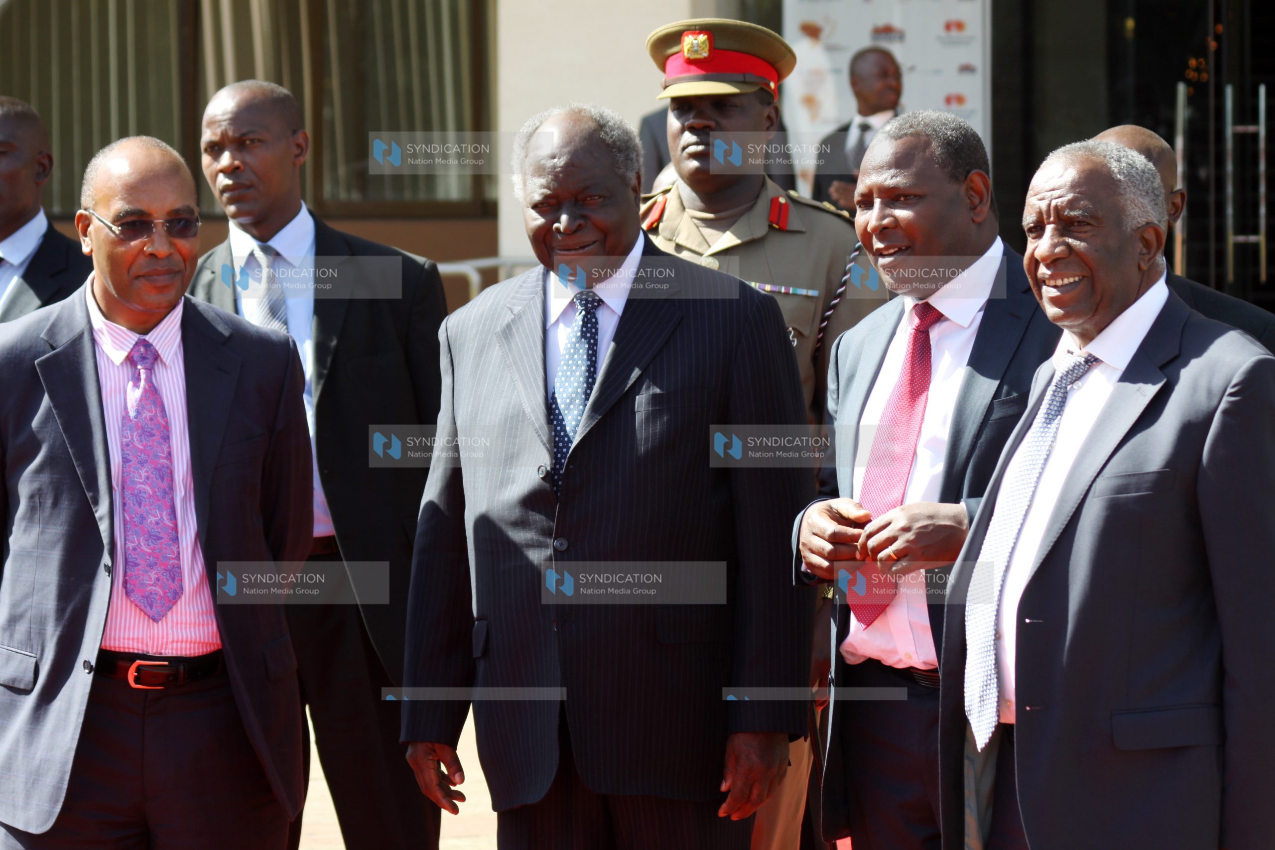 President Mwai Kibaki (second left) chats with Equity Bank Chief Executive Officer James Mwangi