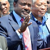 Kalonzo Musyoka (left) addressing a media briefing