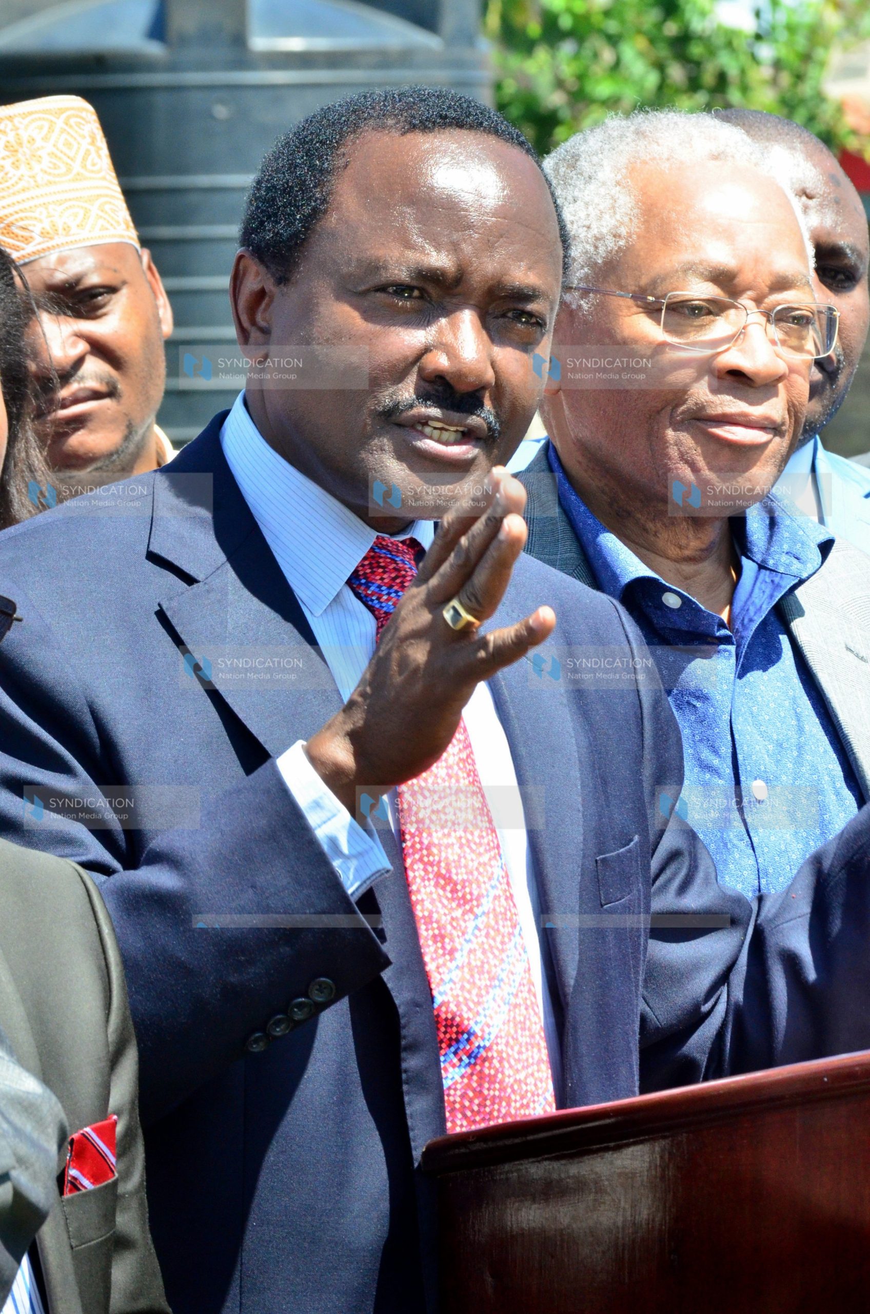 Kalonzo Musyoka (left) addressing a media briefing