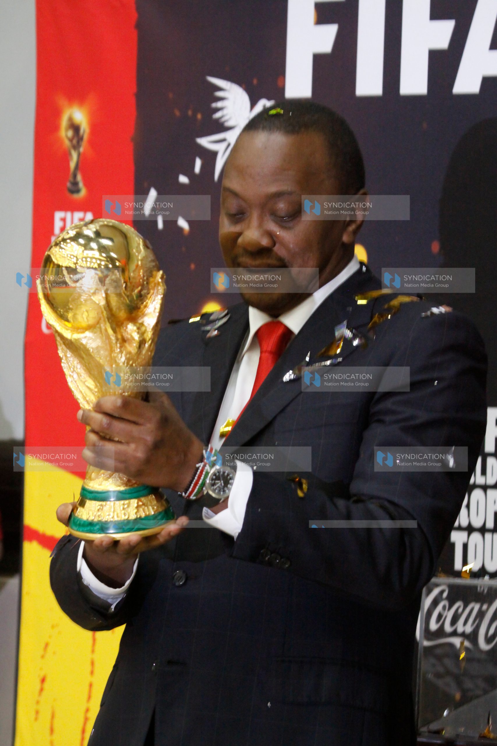 President Uhuru Kenyatta with the FIFA world Cup Trophy