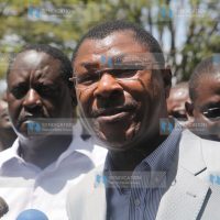 Senator Moses Wetangula addresses the media as Prime Minister Raila Odinga looks on