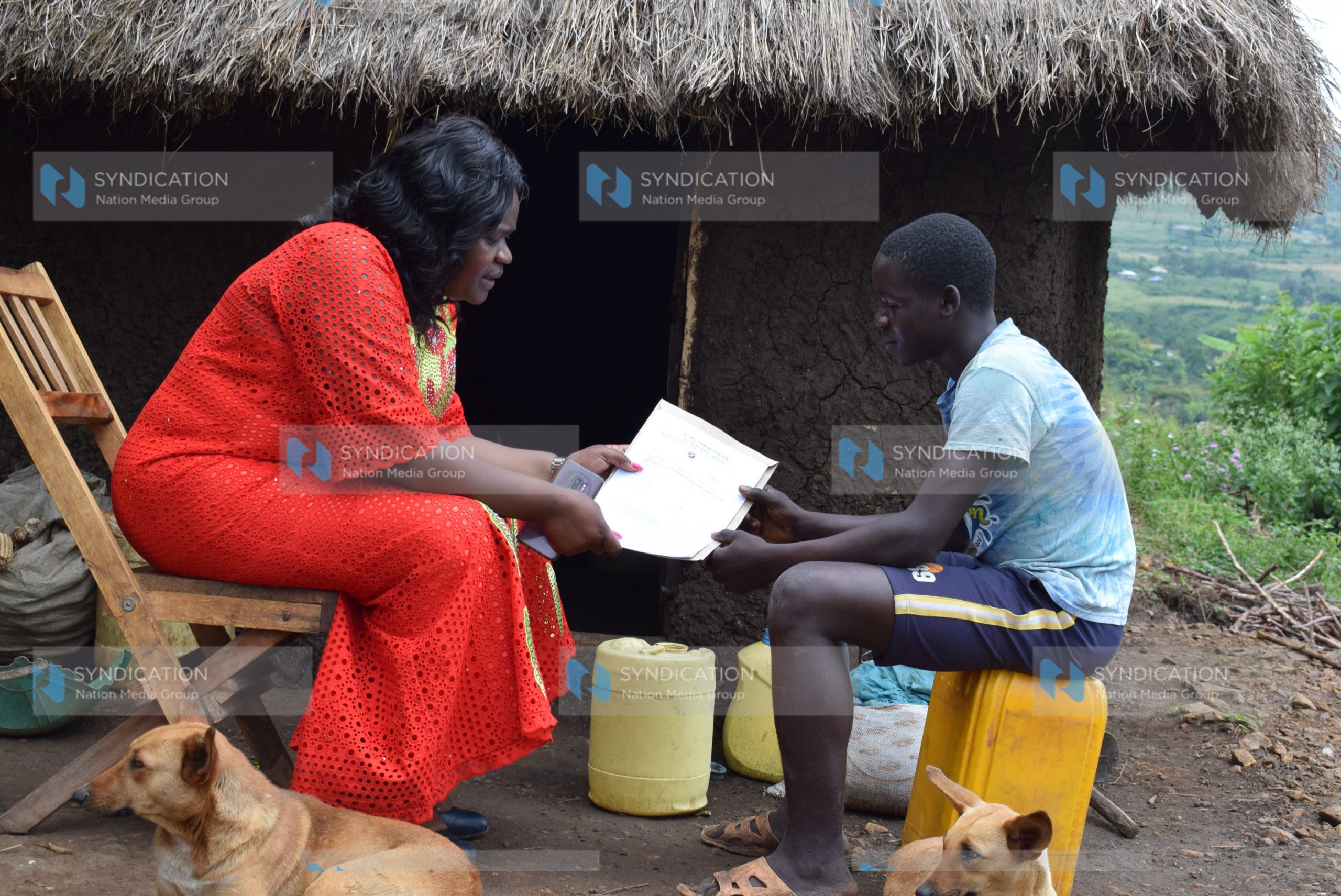 Homa Bay Woman Representative Gladys Wanga chats with Austin Omondi Arunga who scored 407 marks in the 2019 KCPE exams