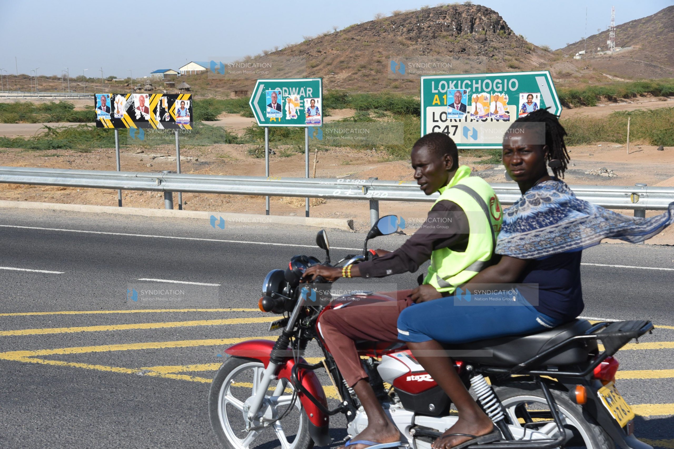 A boda-boda rider ferries a passenger at Kawalase in Lodwar town, Turkana County