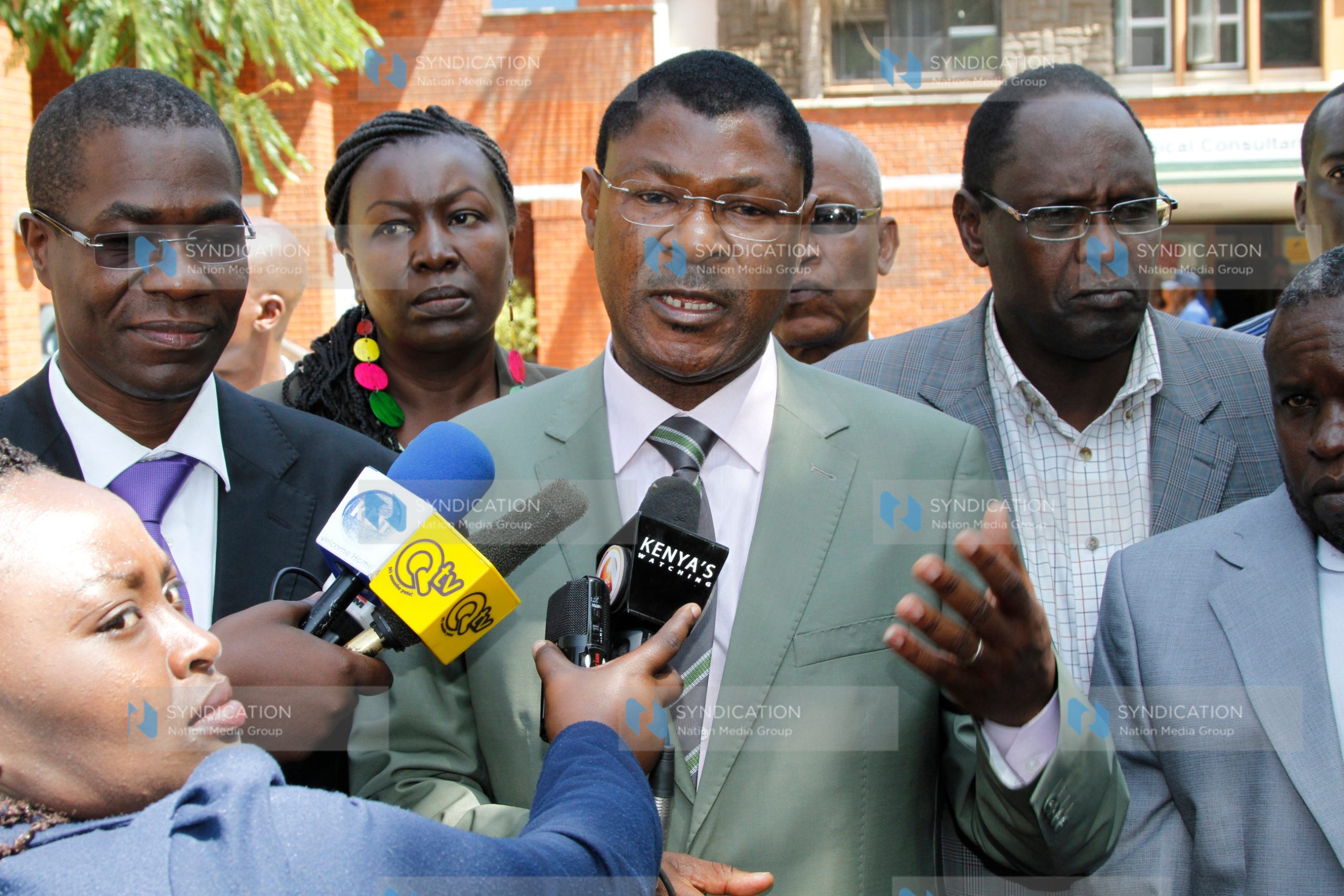Senator Moses Wetang’ula (center) addresses the press outside Aga Khan University Hospital
