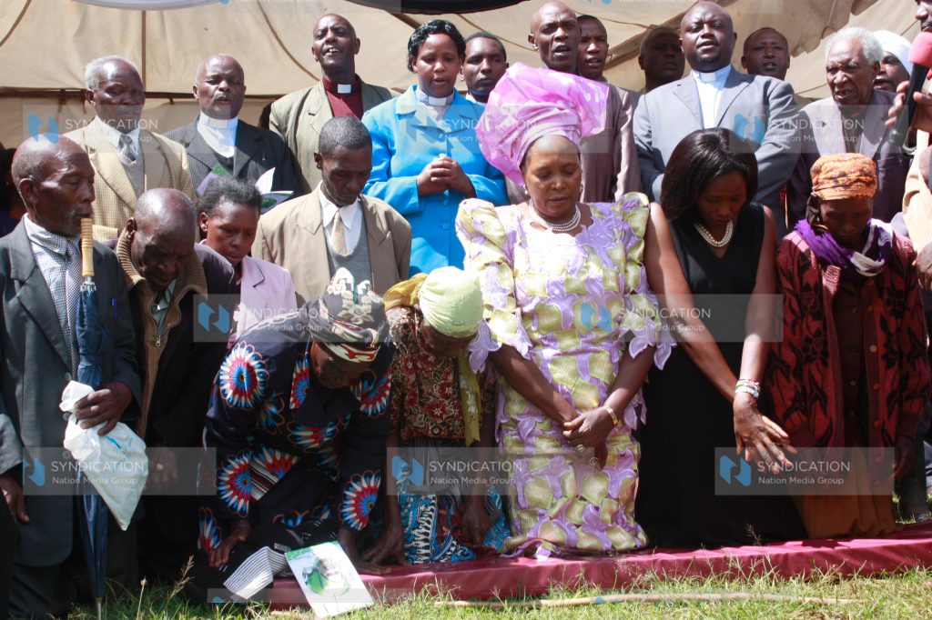 Othaya MP Mary Wambui joins family members in prayers during her homecoming ceremony
