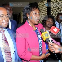 Lands Cabinet Secretary Charity Ngilu (center) speaking to the media