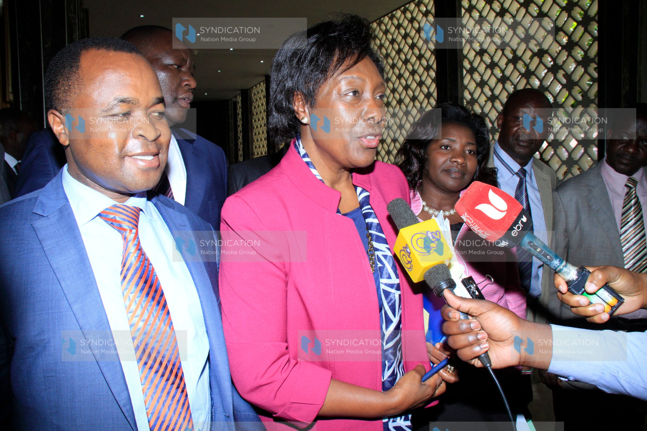 Lands Cabinet Secretary Charity Ngilu (center) speaking to the media