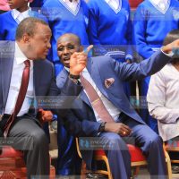 President Uhuru Kenyatta (right) having a word with businessman Peter Muthoka