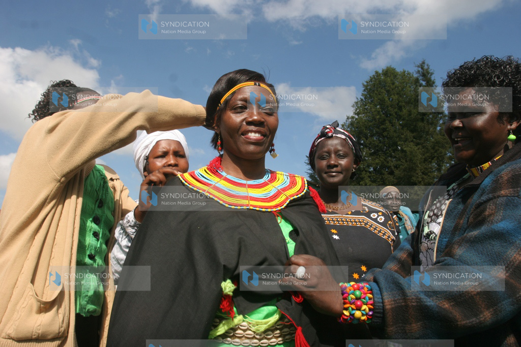 Martha Karua is being clad in a Pokot dress by Pokot women