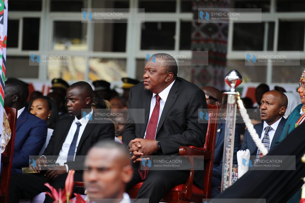Former President Uhuru Kenyatta follows proceedings at Kasarani Stadium