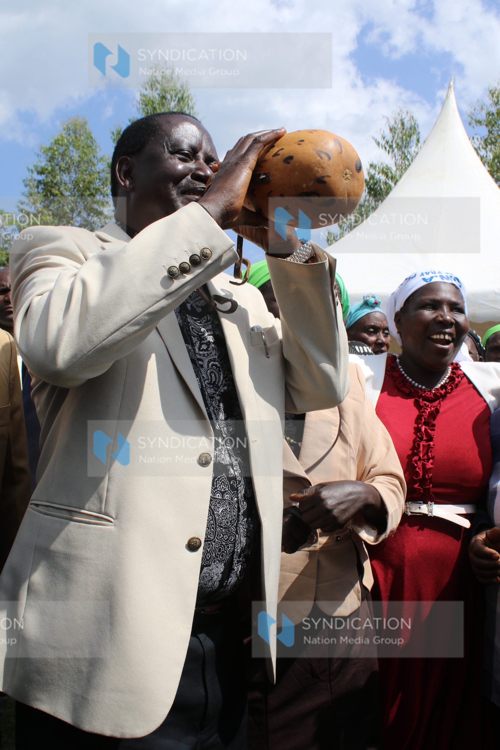 CORD leader Raila Odinga sips mursik from a gourd