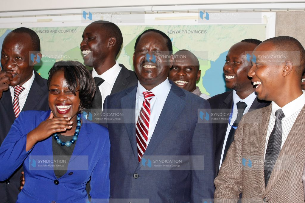 Raila Odinga receives an award from Greenhand Organisation Chair Ham Lagat