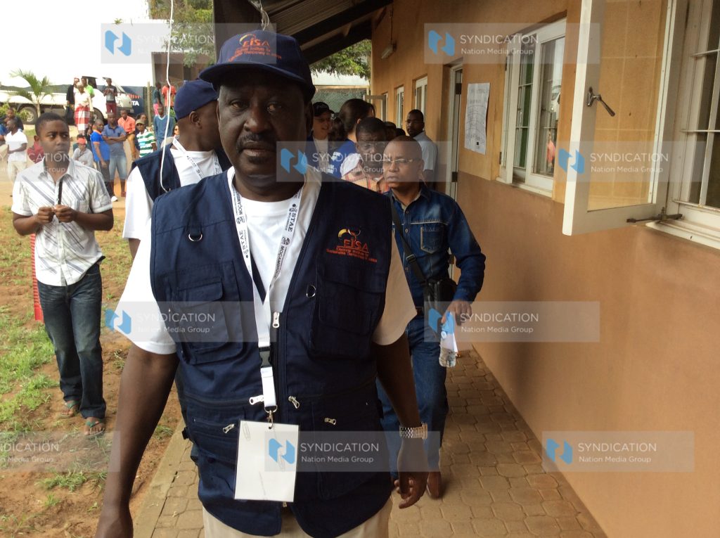 Former Prime Minister Raila Odinga arrives at a polling station in Maputo, Mozambique