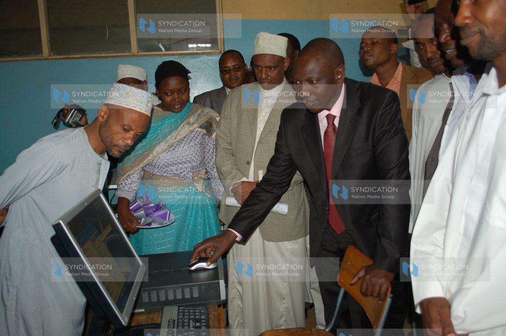 Suspended Higher education Minister William Ruto tries a computer