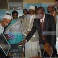 Suspended Higher education Minister William Ruto tries a computer
