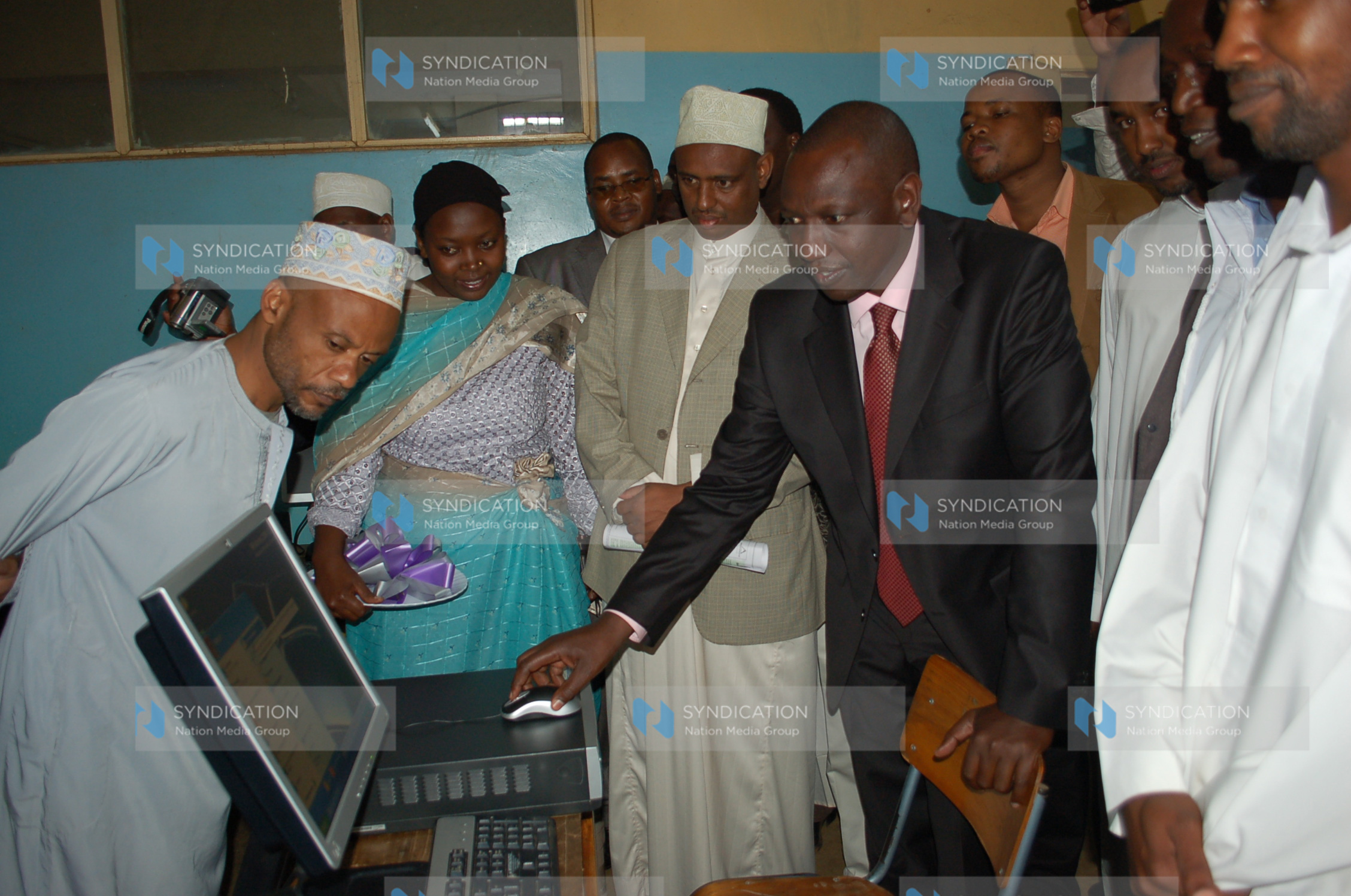 Suspended Higher education Minister William Ruto tries a computer