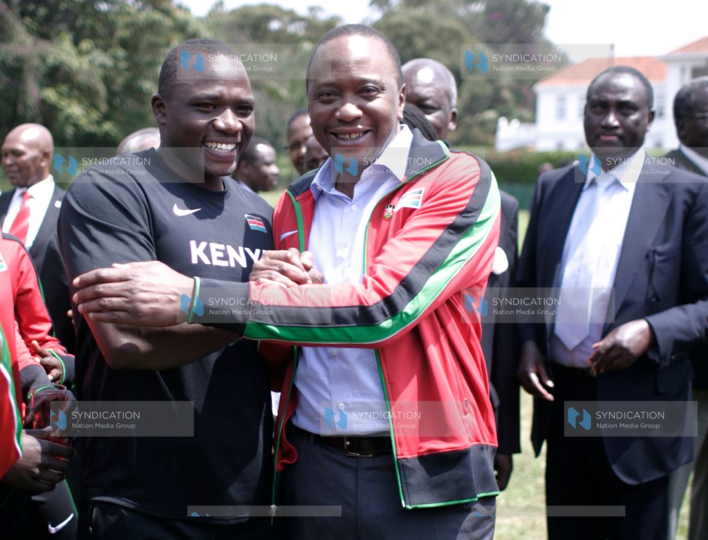 President Kenyatta poses with captain Julius Yego