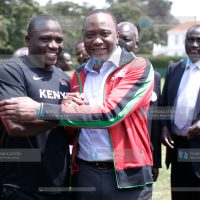 President Kenyatta poses with captain Julius Yego