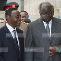 Standard Chartered Bank chairman Wilfred Kiboro takes President Mwai Kibaki round the newly inaugurated Standard Chartered Bank Head office