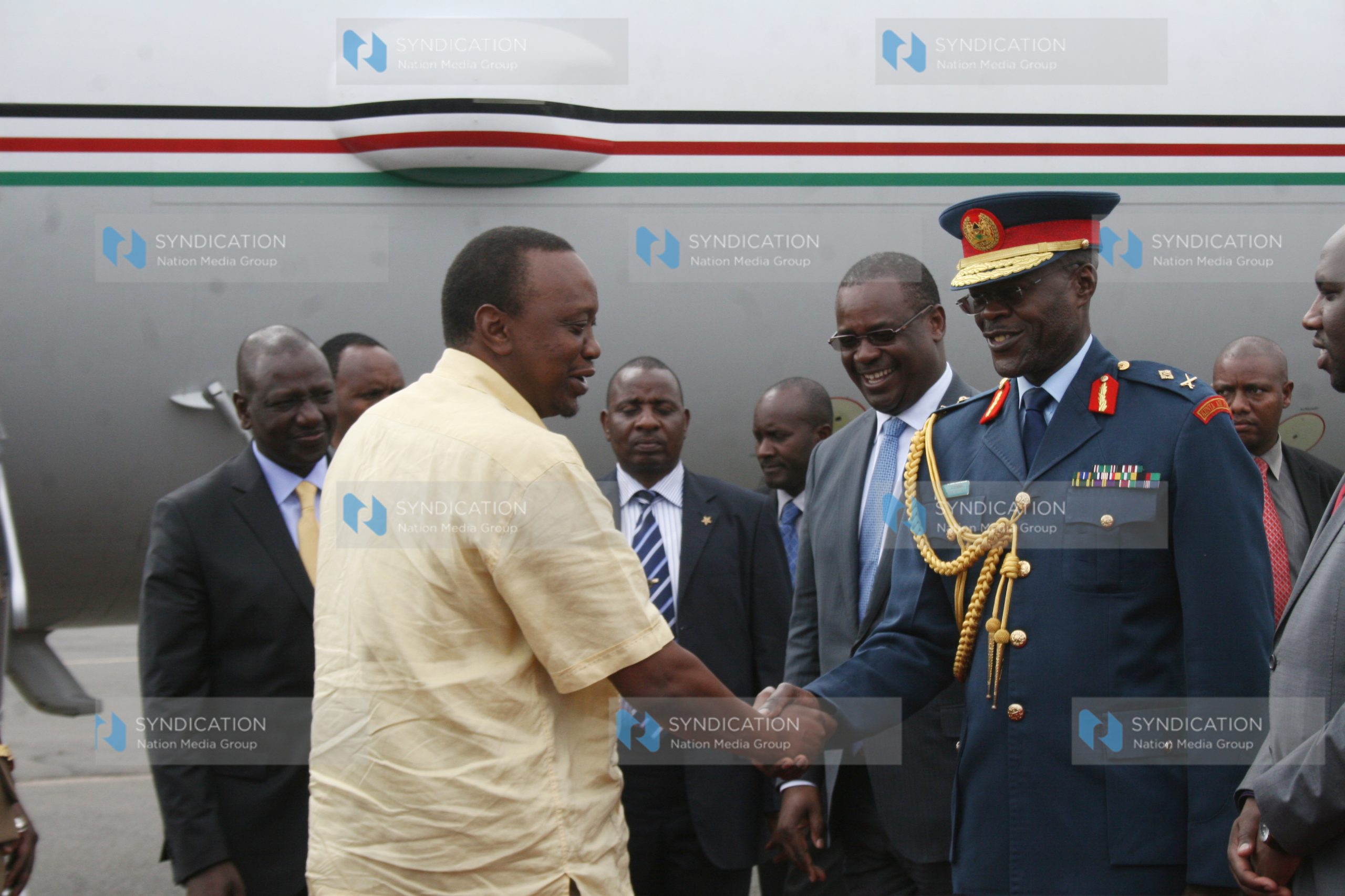 President Uhuru Kenyatta greets Kenya Airforce Commander Maj Gen Joff Otieno