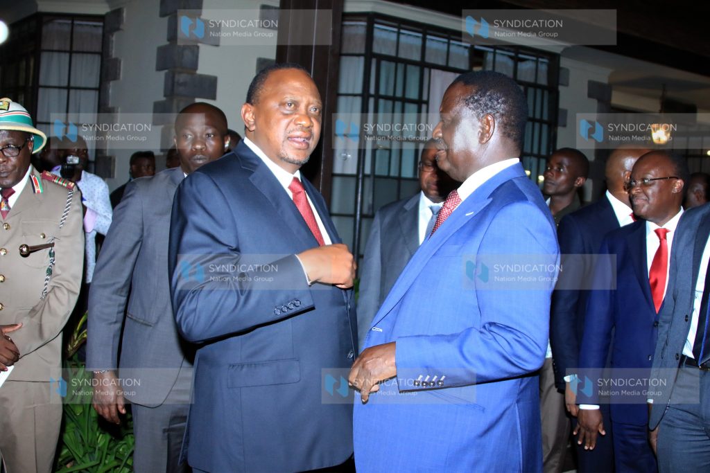 President Uhuru Kenyatta speaks with African Union's High Representative for Infrastructure Development Raila Odinga