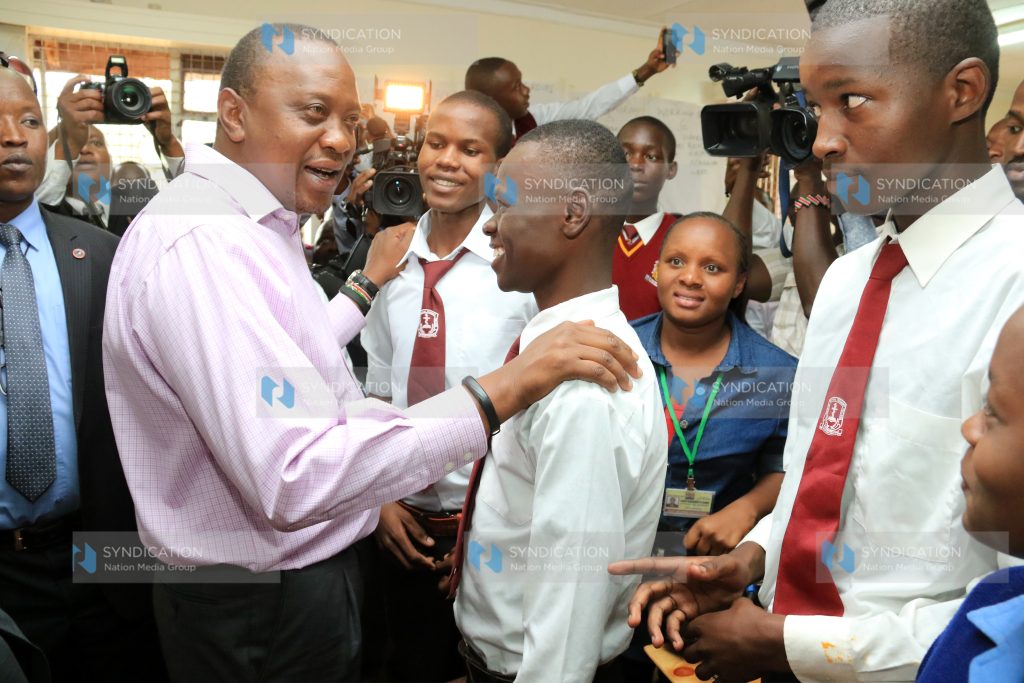 President Uhuru Kenyatta chats with some of Kenya Medical Training Collage