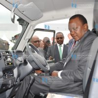 President Uhuru Kenyatta tries out a vehicle during the Official Opening of the Toyota Kenya Limited Business Park