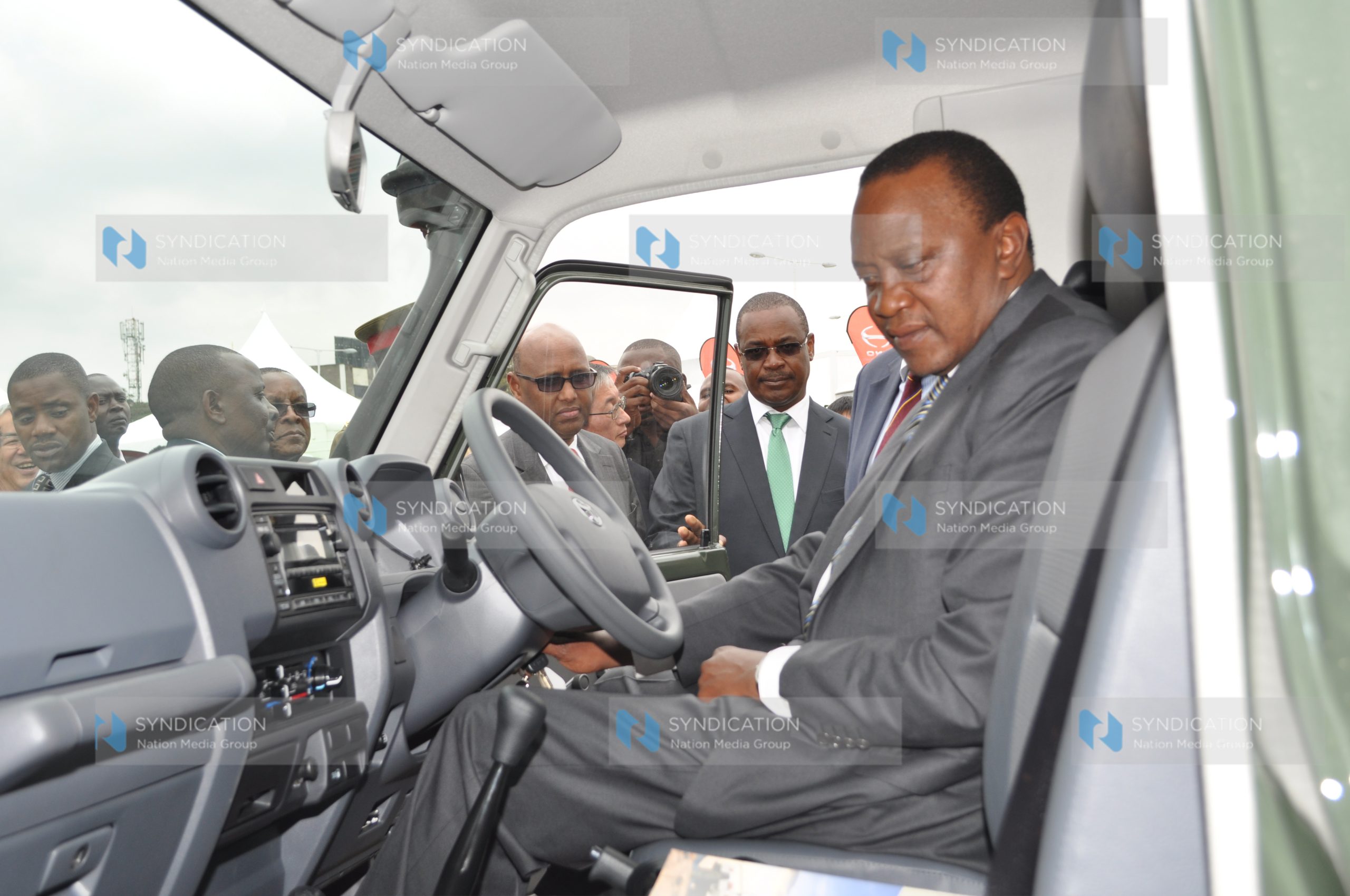 President Uhuru Kenyatta tries out a vehicle during the Official Opening of the Toyota Kenya Limited Business Park