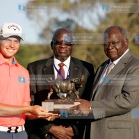 South Africa Haydn Porteous display's Barclays Kenya Open winner's Trophy flanked by Barclays Bank chairman Francis Okello and Kenya Golf Union patron