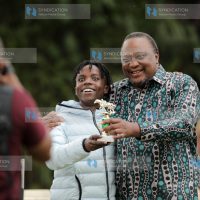 Jockey Micheal Fundi with Retired President Uhuru Kenyatta