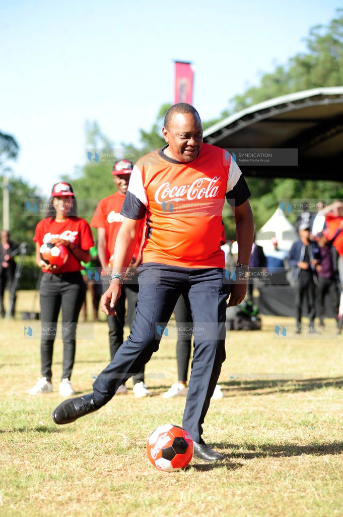 President Uhuru Kenyatta plays a penalty with Harambee Stars goalkeeper Patrick Matasi