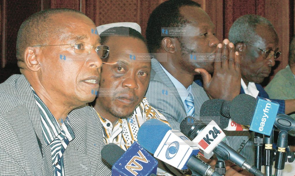 From left: Mutula Kilonzo, Uhuru Kenyatta, Raphael Tuju, and Sam Ongeri address a press conference