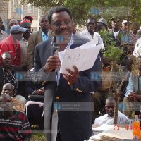 The Minister for Lands Mr. James Orengo displaying a copy of fake title deeds