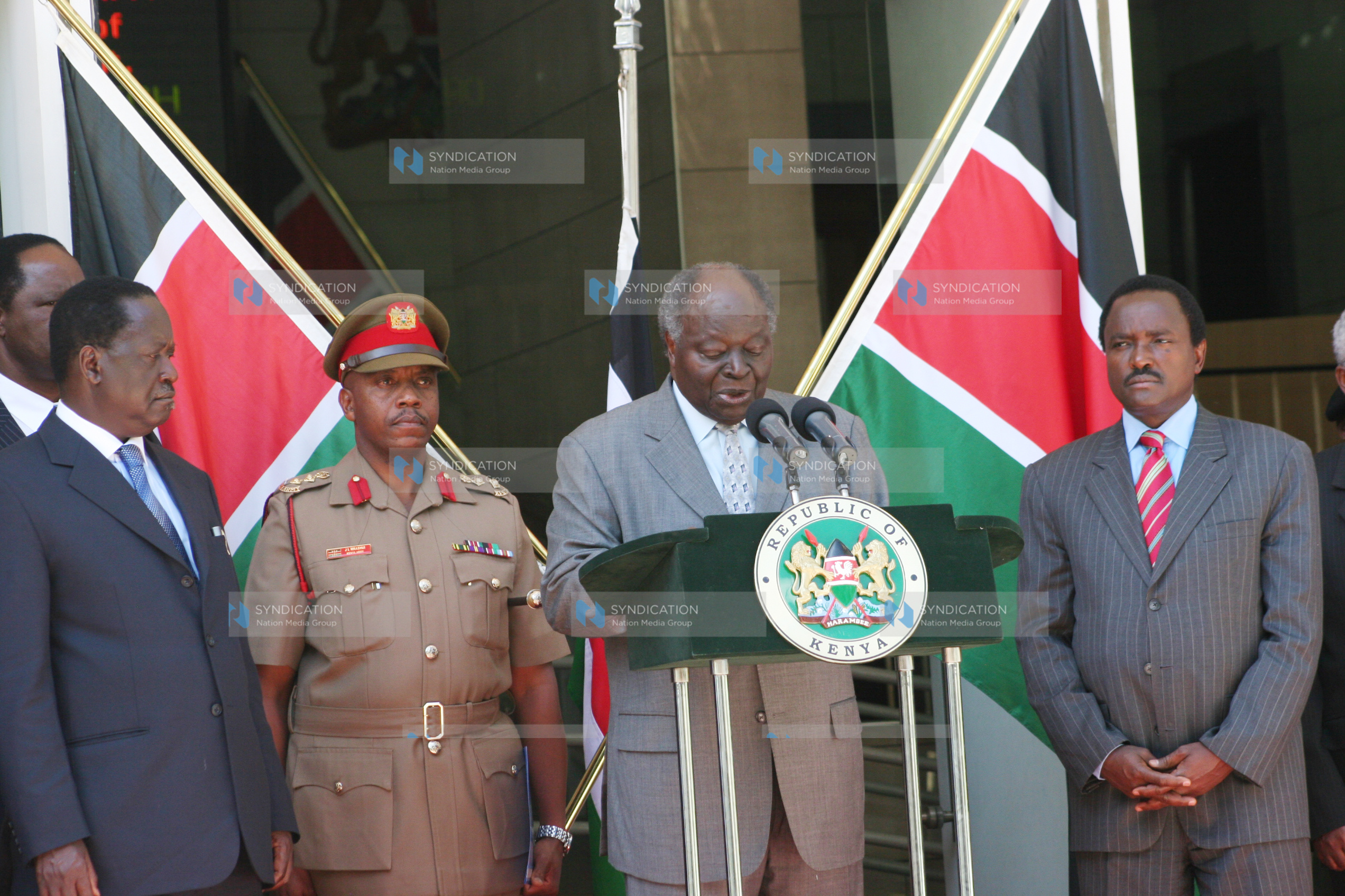 President Mwai Kibaki address journalists outside his Harambee House office