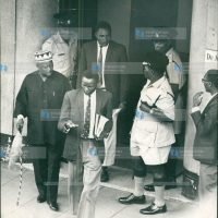 Special Branch and uniformed police officers swoops on the private offices of Mr. Jaramogi Oginga Odinga (left in a beaded cap)