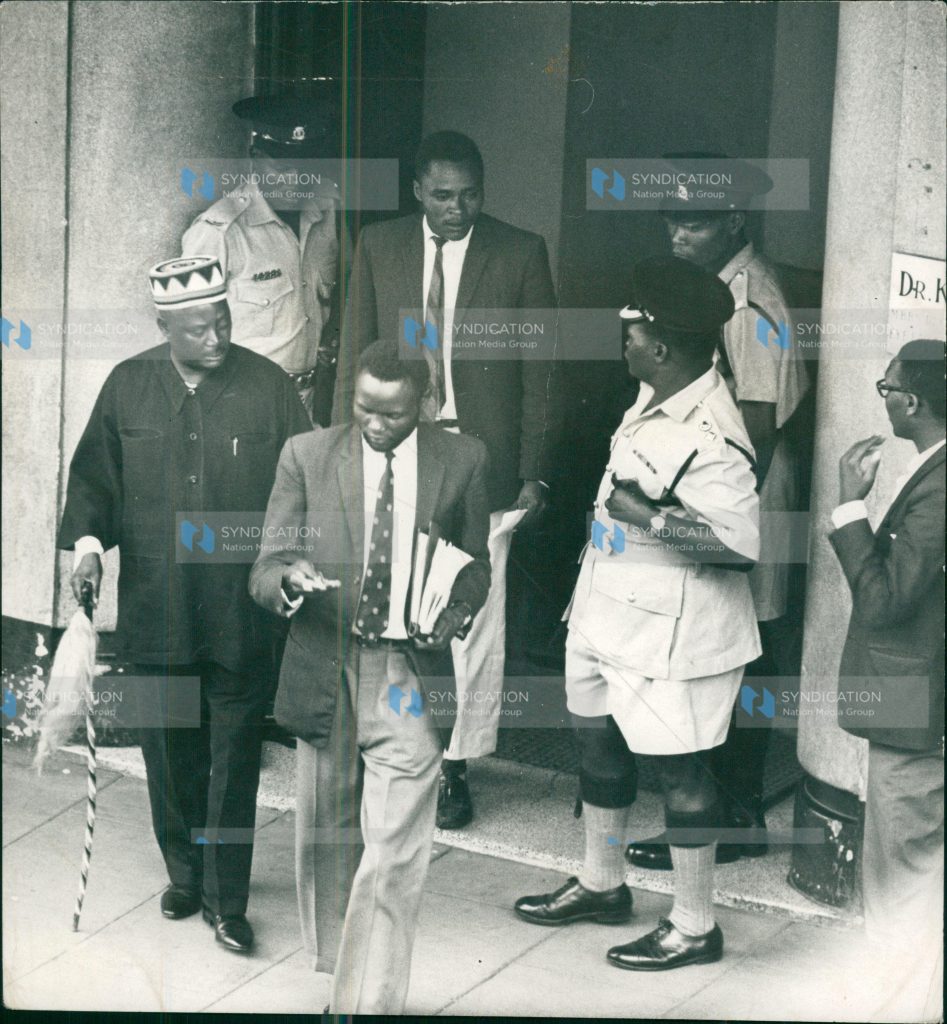 Special Branch and uniformed police officers swoops on the private offices of Mr. Jaramogi Oginga Odinga (left in a beaded cap)