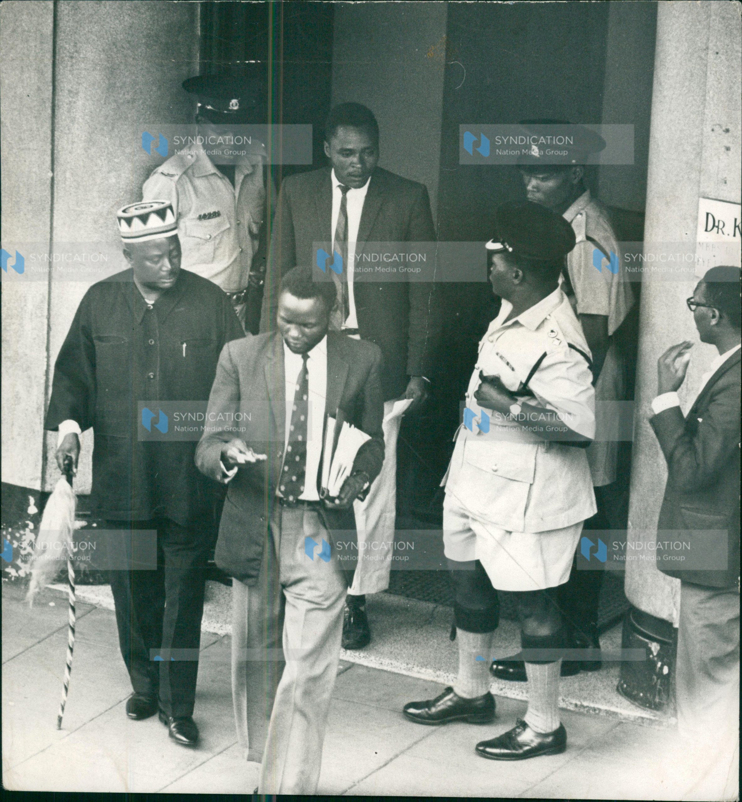 Special Branch and uniformed police officers swoops on the private offices of Mr. Jaramogi Oginga Odinga (left in a beaded cap)