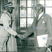 President Mzee Jomo Kenyatta congratulates Brig. Joseph Musyimi Ndolo (left)
