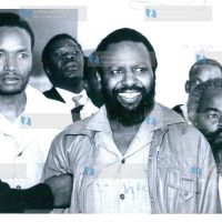 Former legislator George Moseti Anyona (center) and three other men are jailed for seven years