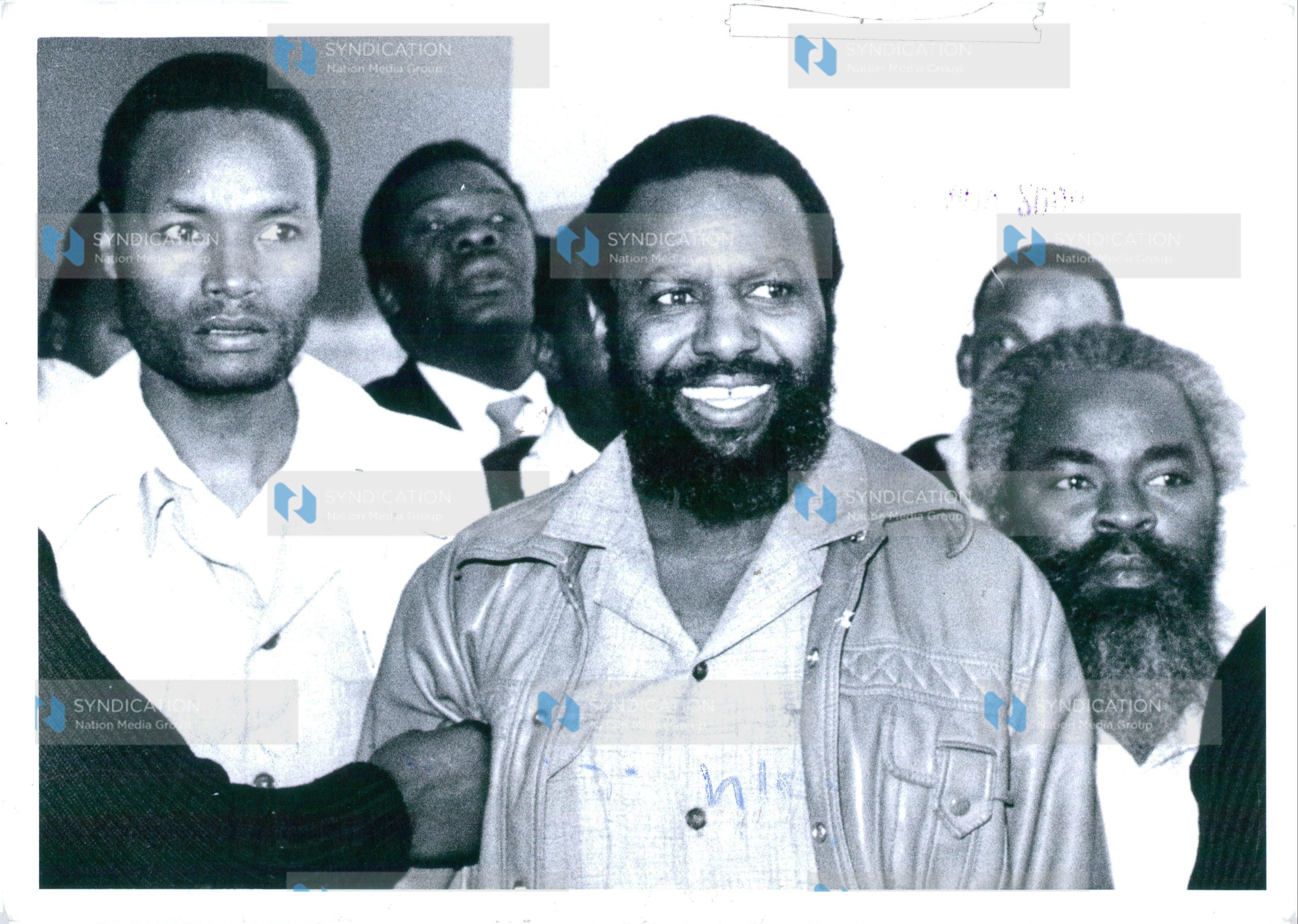 Former legislator George Moseti Anyona (center) and three other men are jailed for seven years